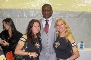 Bryna and Jordan steal a squeeze from Reggie Bush